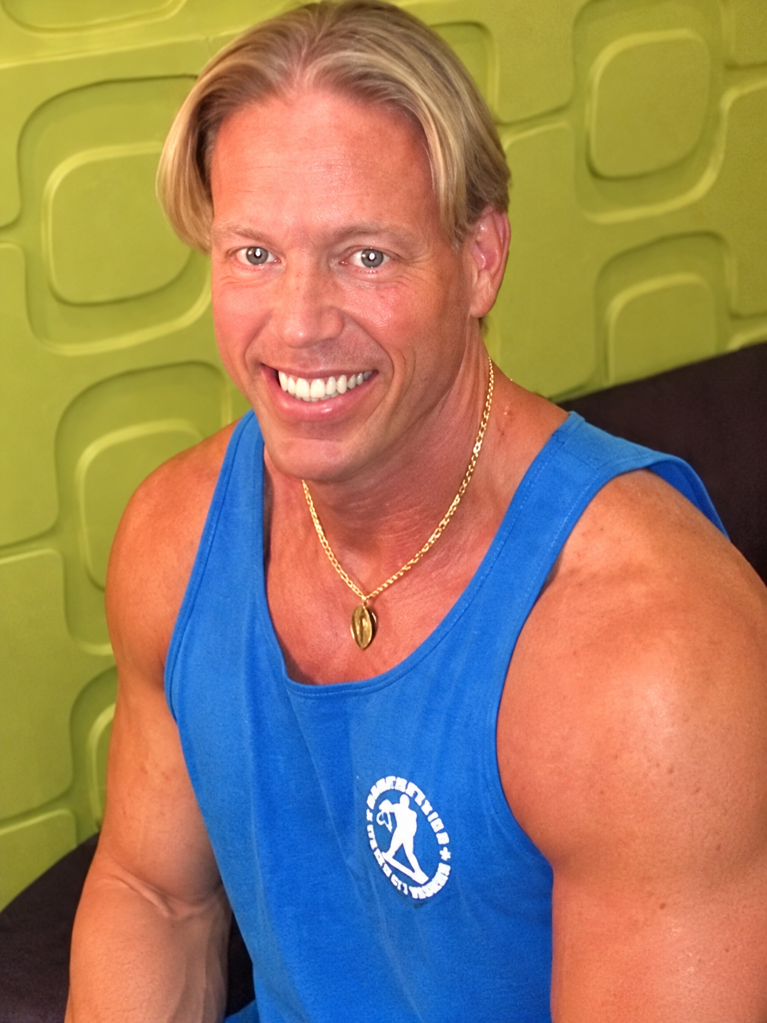 Smiling Muscle Portrait in Blue Tank